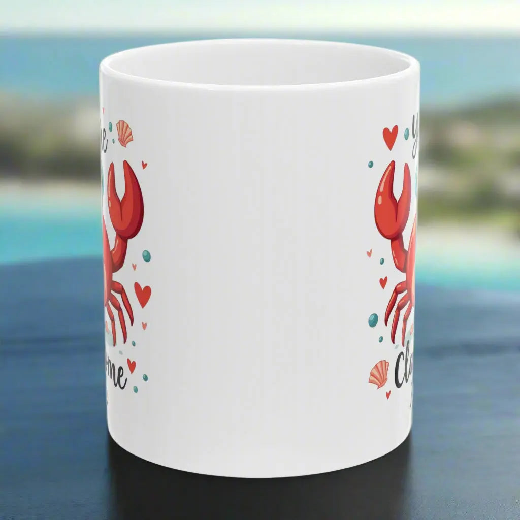 Side view of white 11 oz ceramic mug with happy crab with text You're Clawsome personalized with recipient name. Ideal for crab lovers, personalized gift seekers, and those looking to add some fun to their daily beverage enjoyment.