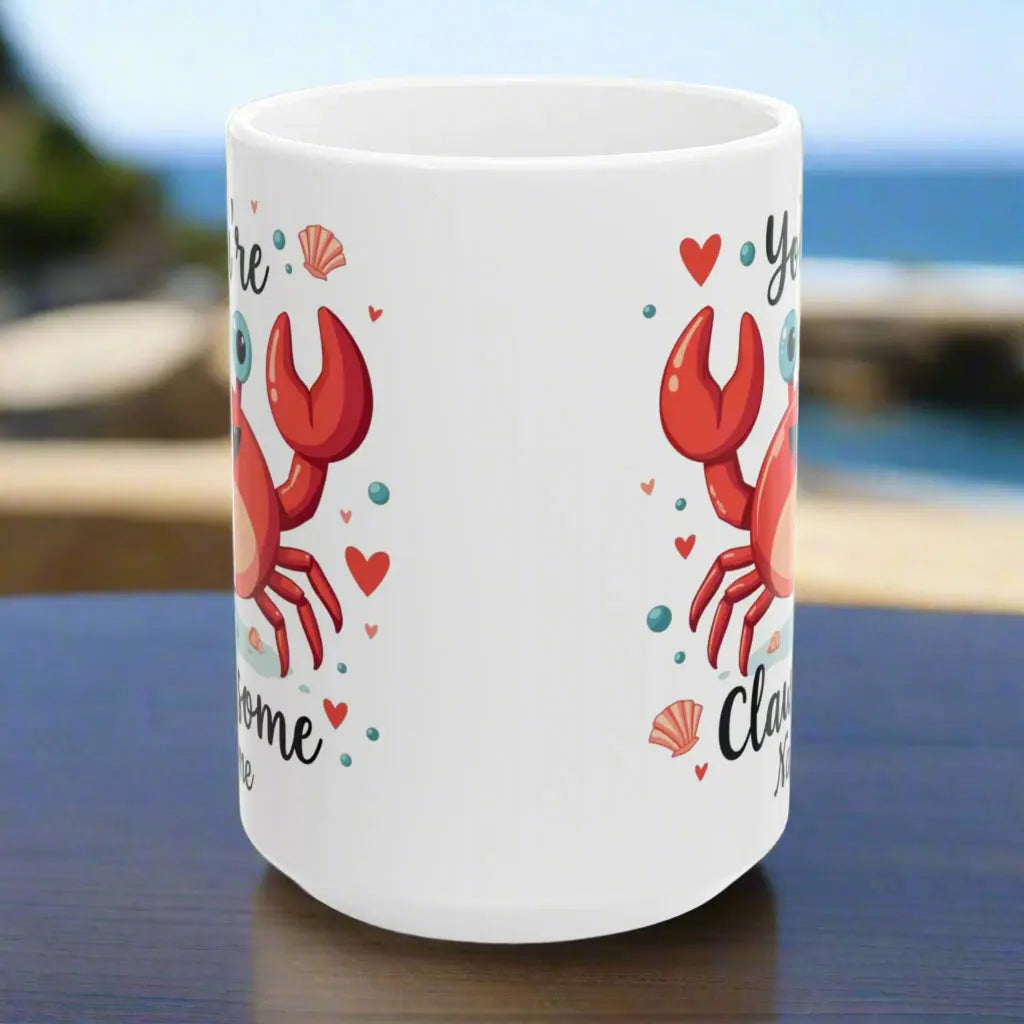 Side view white ceramic 15 oz mug with happy crab with text You're Clawsome personalized with recipient name. Ideal for crab lovers, personalized gift seekers, and those looking to add some fun to their daily beverage enjoyment.