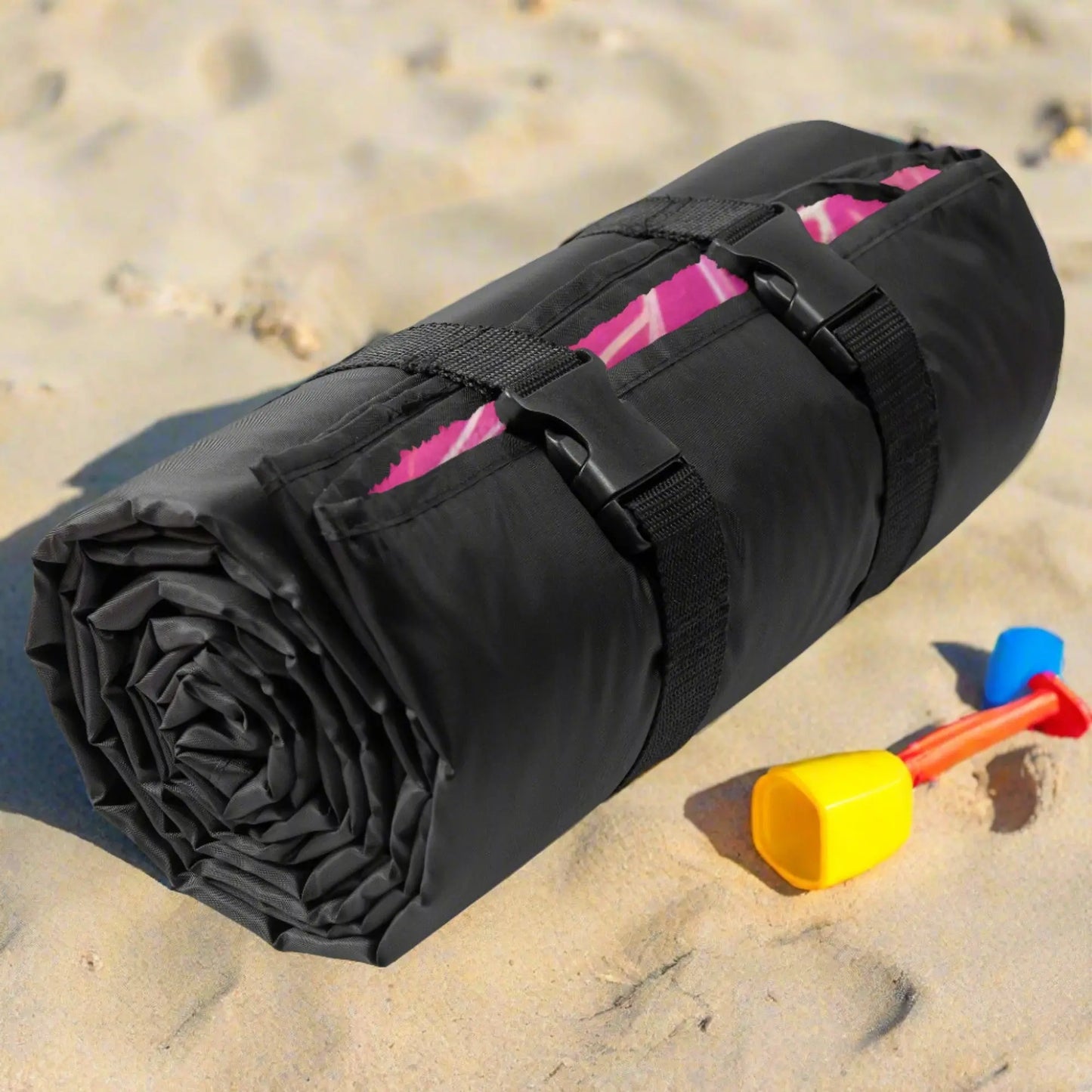 Rolled up beach blanket with buckles and handles