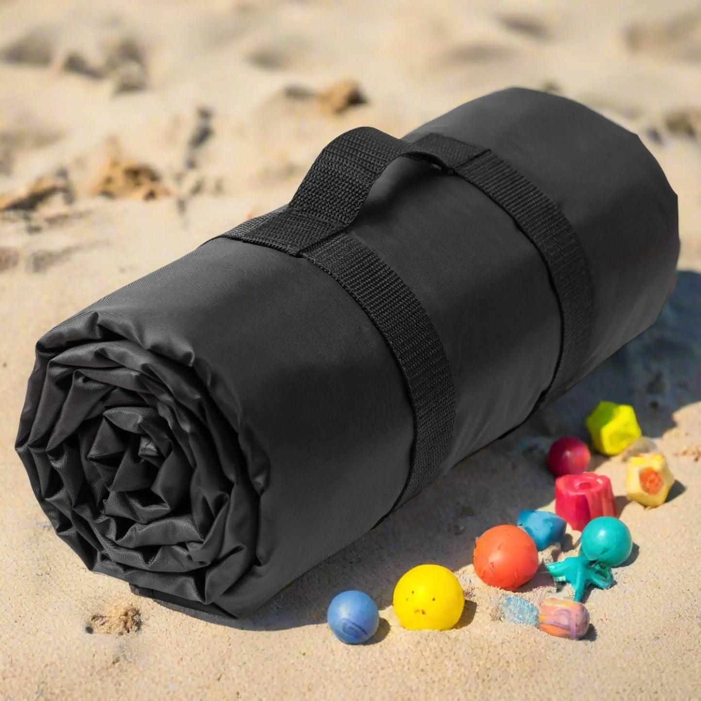 Beach blanket rolled up with handle