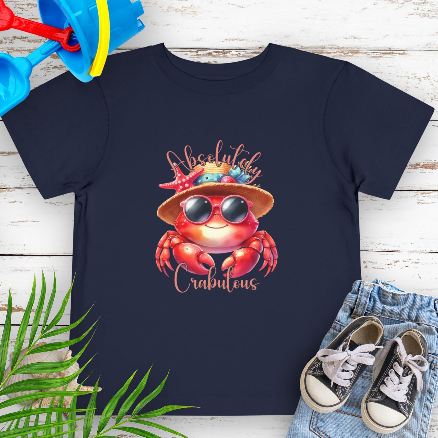 Navy blue toddler t-shirt with a red crab wearing sunglasses and a hat and text 'Absolutely Crabulous'.