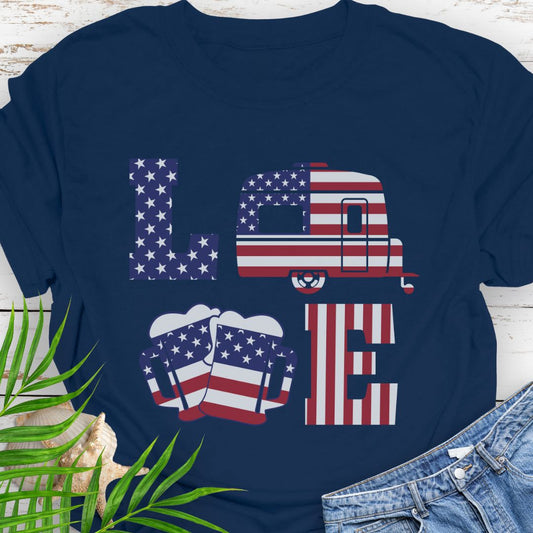Navy T-shirt with patriotic LOVE design: blue star-patterned L, American flag camper as O, beer mugs forming V, and red-striped E – playful 4th of July theme.