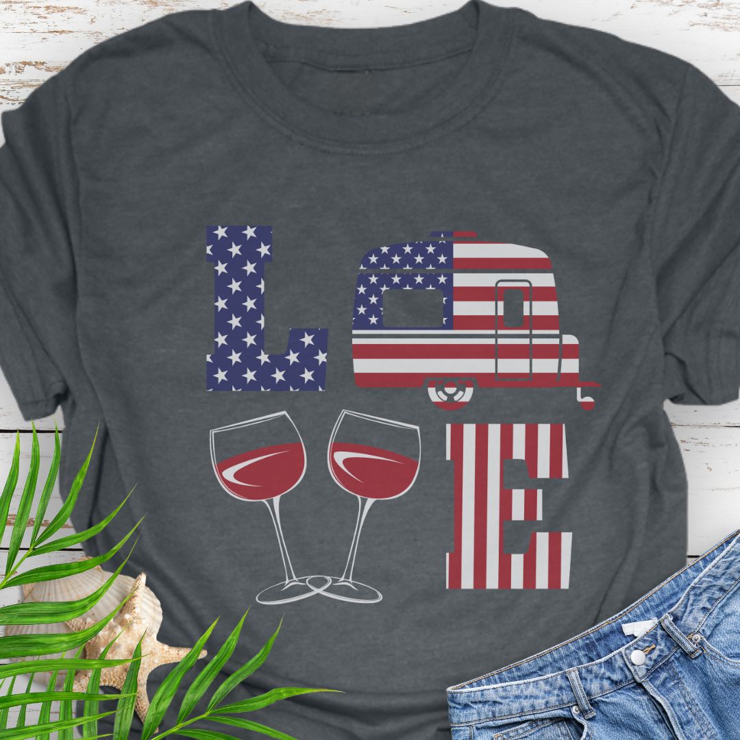 Dark heather patriotic LOVE t-shirt design with stars-and-stripes letters, camper, and wine glasses for American-themed camping and wine lovers.