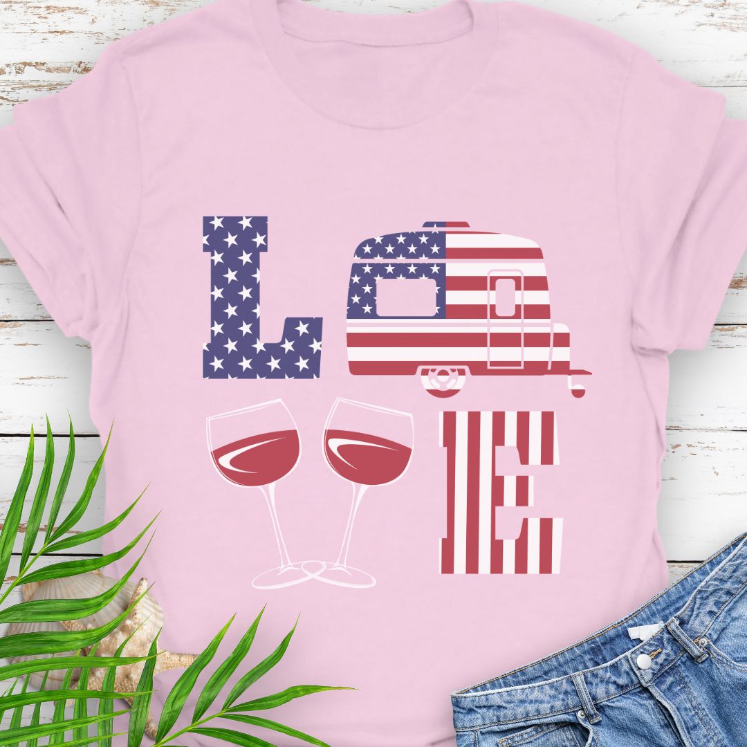 Light Pink patriotic LOVE t-shirt design with stars-and-stripes letters, camper, and wine glasses for American-themed camping and wine lovers.