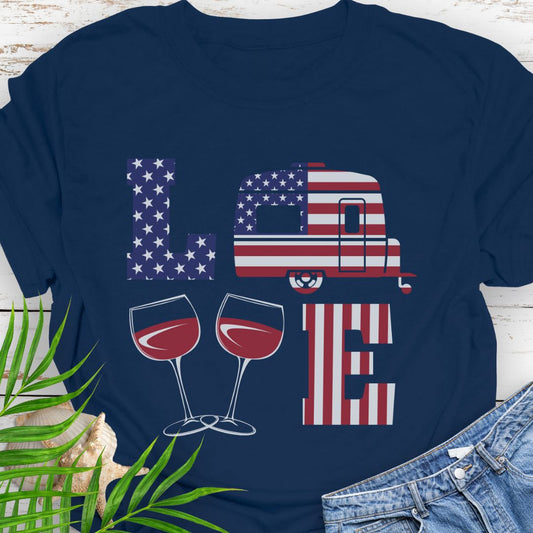 Navy patriotic LOVE t-shirt design with stars-and-stripes letters, camper, and wine glasses for American-themed camping and wine lovers.