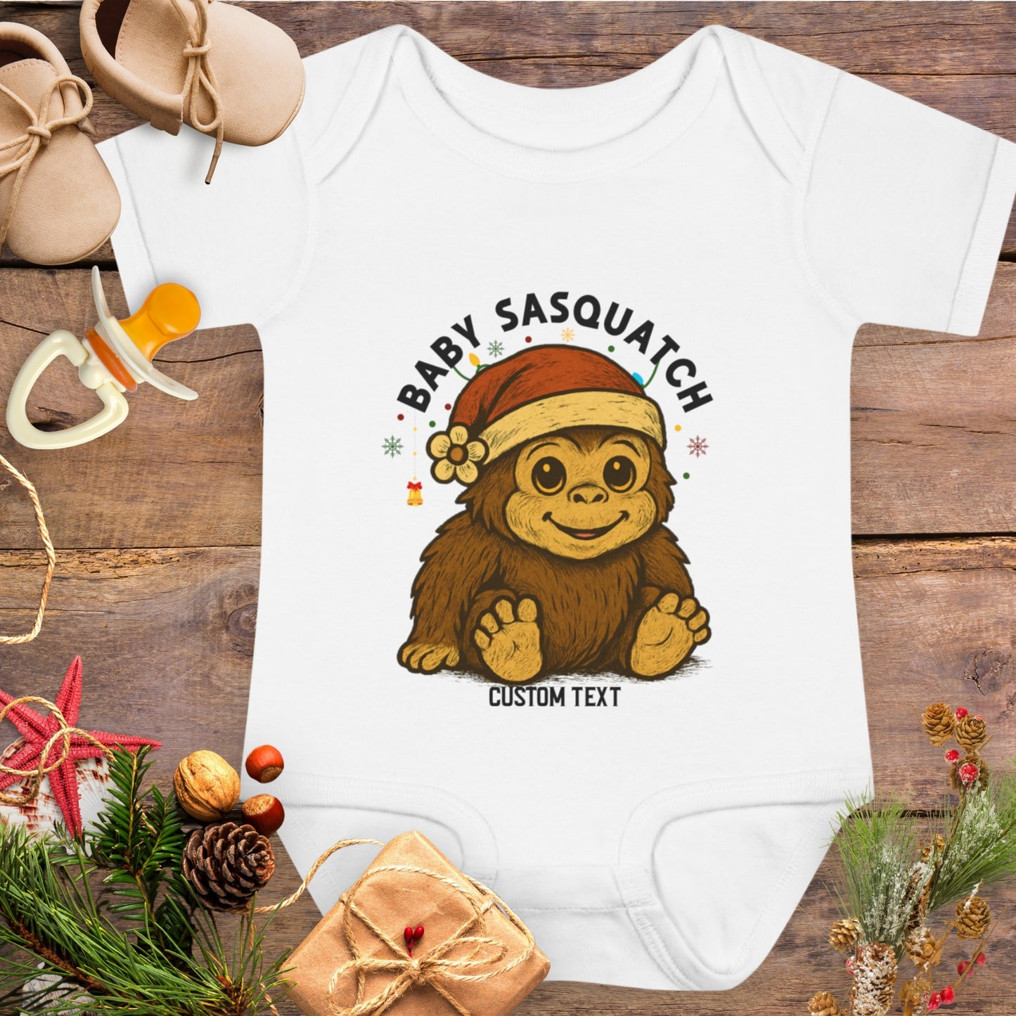 Baby onesie with 'Baby Sasquatch' design with custom text.
