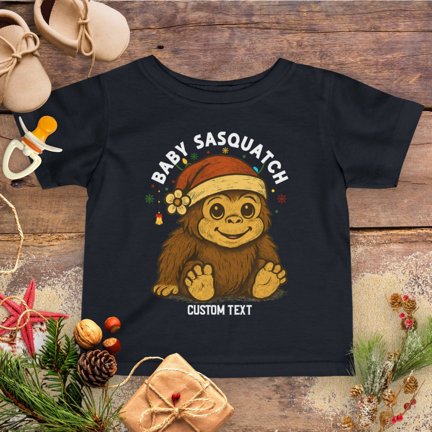 Black t-shirt with a cartoon Sasquatch wearing a Santa hat personalized.