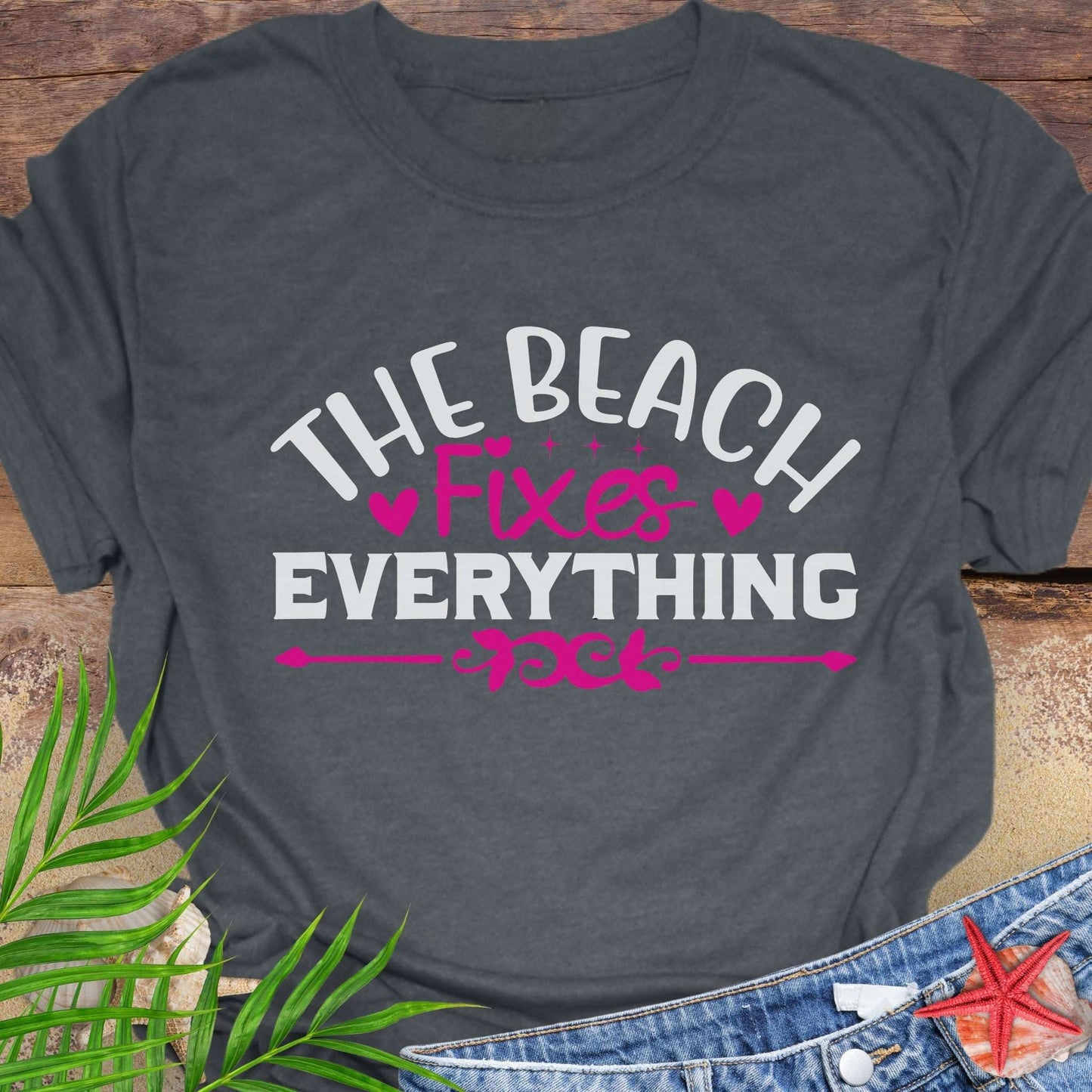 Dark Heather Gray t-shirt with 'The Beach Fixes Everything' text.