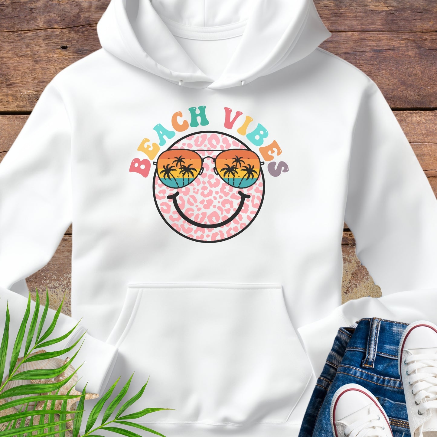 White hoodie with 'Beach Vibes' colorful retro happy face design.