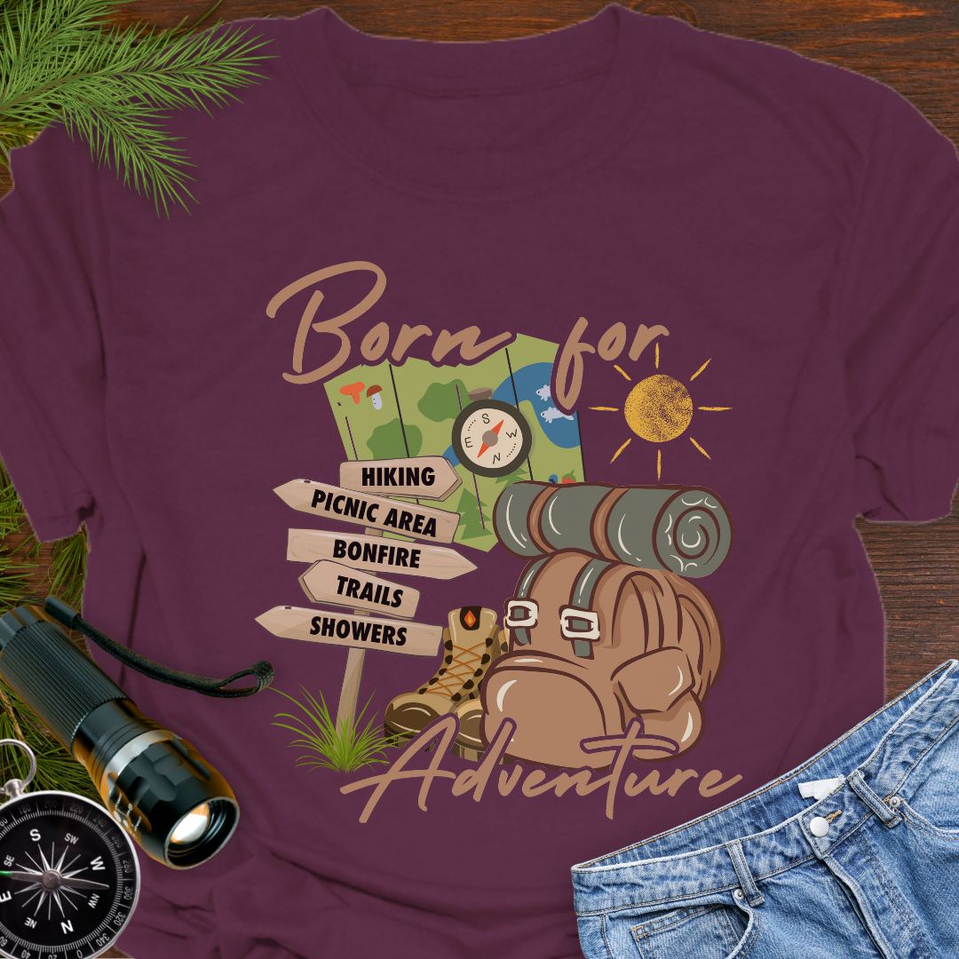 Maroon T-shirt perfect for hikers with a backpack with sleeping bag roll, hiking boots, trail sign, map and sun that says Born for adventure.