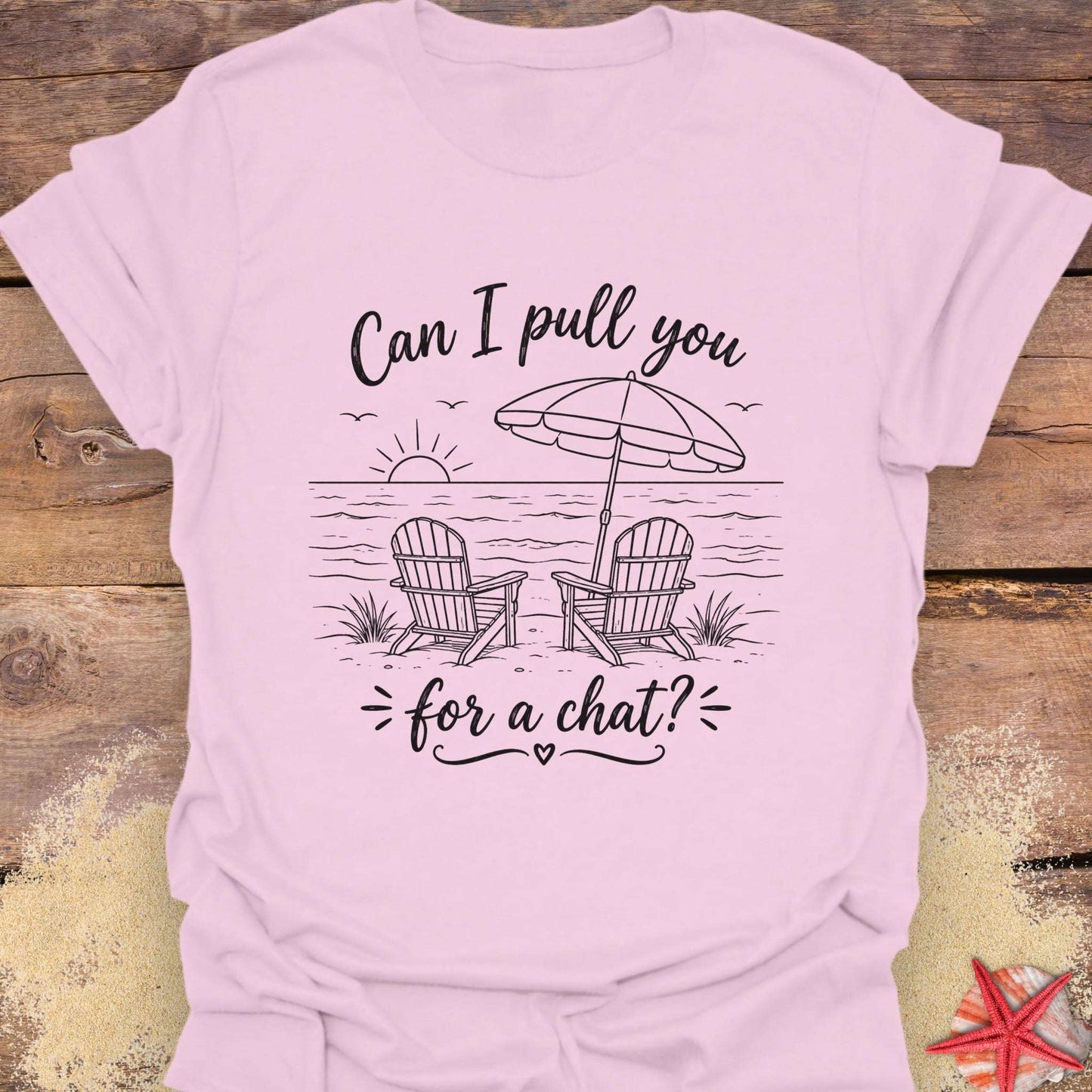 Pink t-shirt with a beach graphic and text "Can I pull you for a chat?".