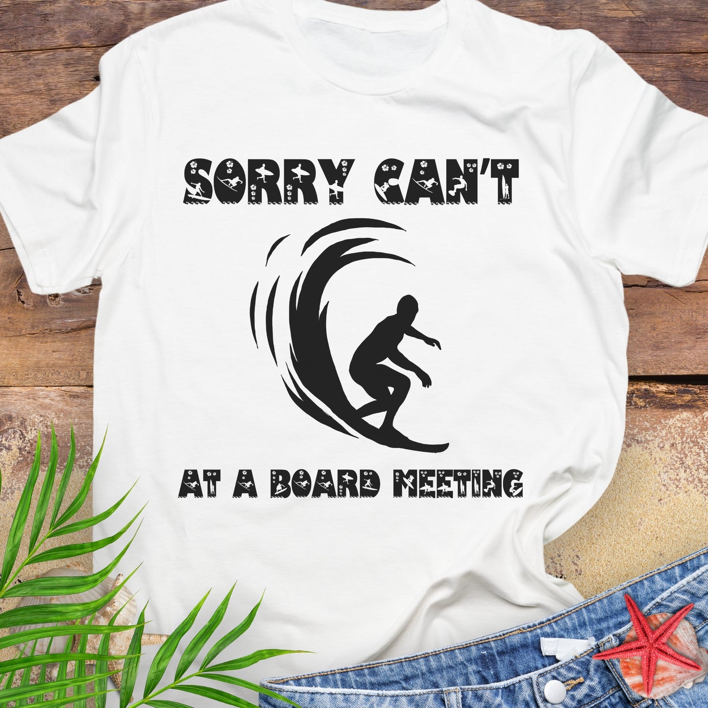 White t-shirt with a surfer and says Sorry Can't Board Meeting.