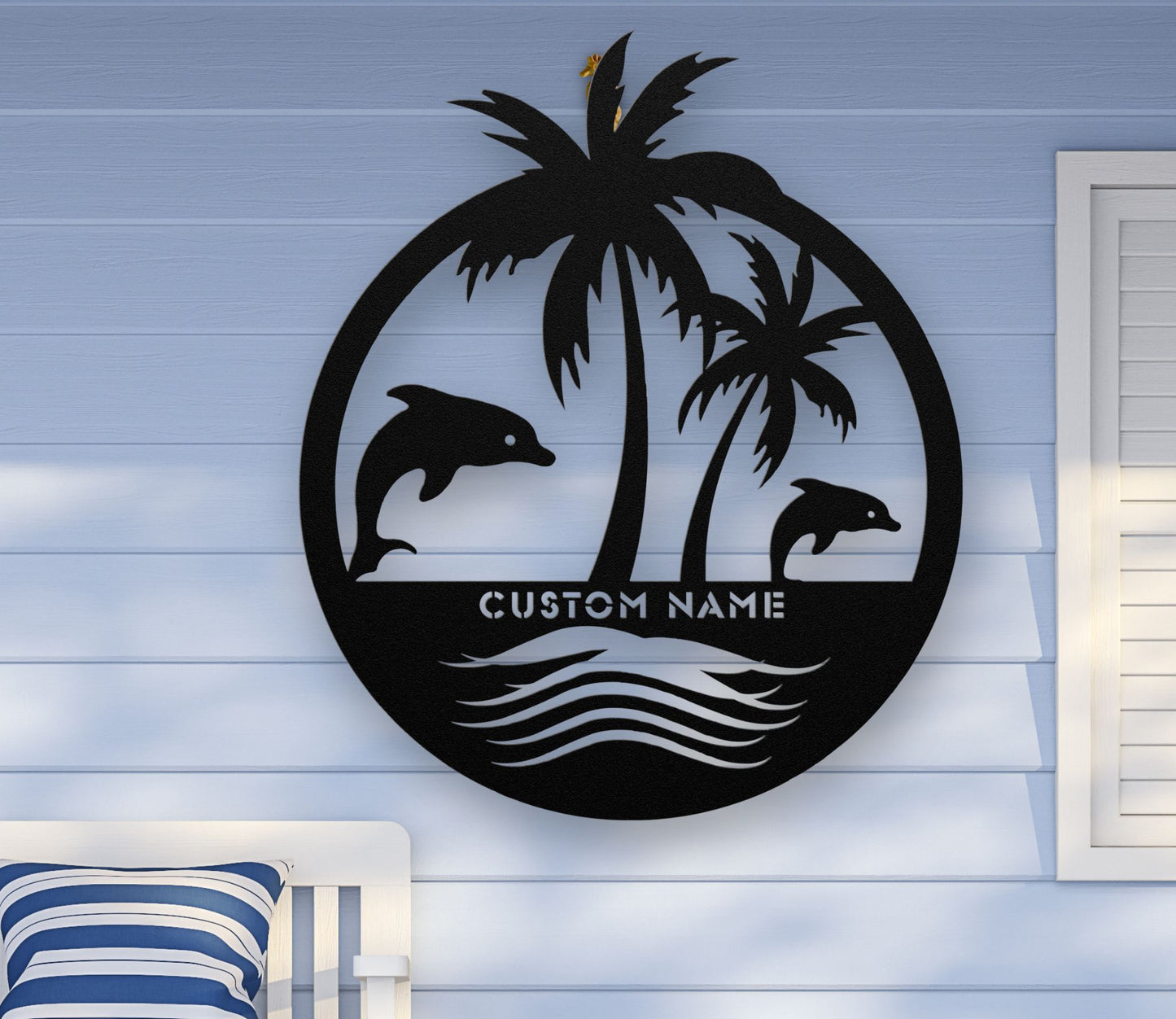 Black custom metal wall art featuring two dolphins jumping near palm trees with space for a family name, established year, or custom phrase in various sizes.