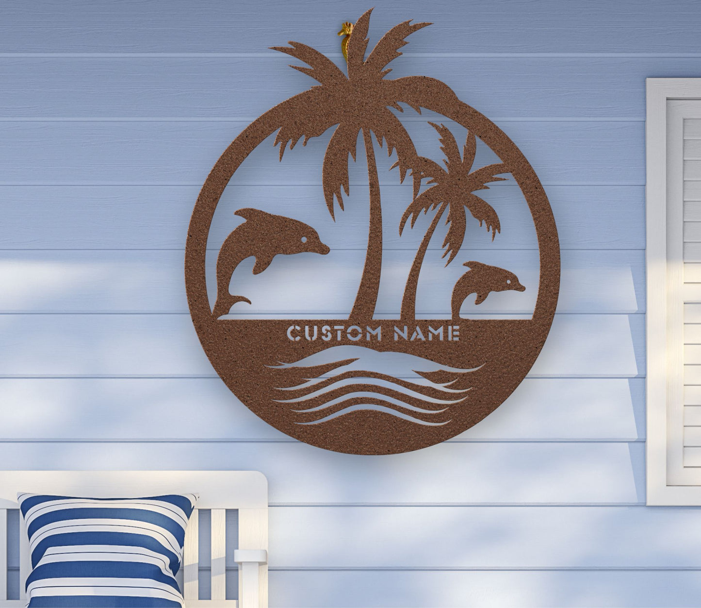 Copper custom metal wall art featuring two dolphins jumping near palm trees with space for a family name, established year, or custom phrase in various sizes.