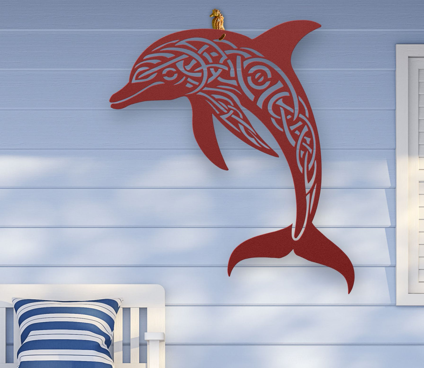 Red metal wall art featuring a dolphin silhouette with detailed Celtic knot design inside, crafted from steel and available in various sizes and colors.