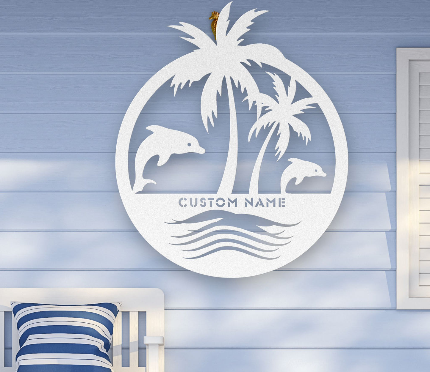 White custom metal wall art featuring two dolphins jumping near palm trees with space for a family name, established year, or custom phrase in various sizes.