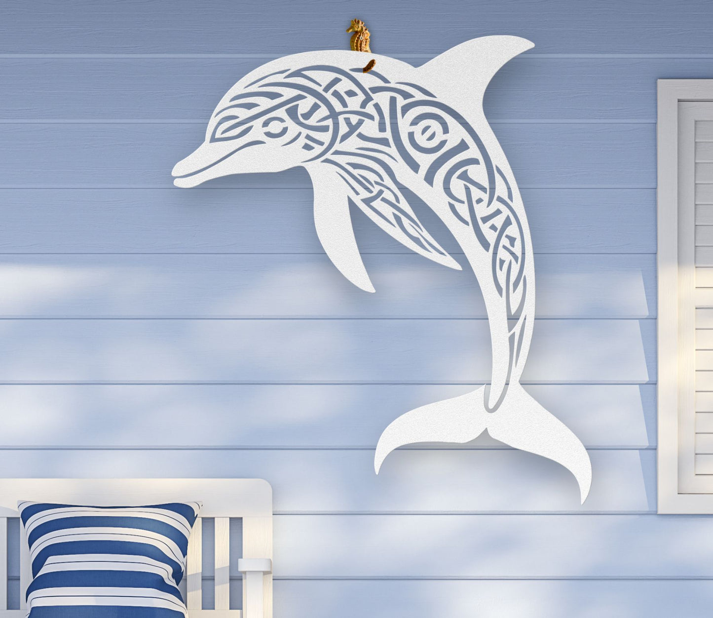 White metal wall art featuring a dolphin silhouette with detailed Celtic knot design inside, crafted from steel and available in various sizes and colors.