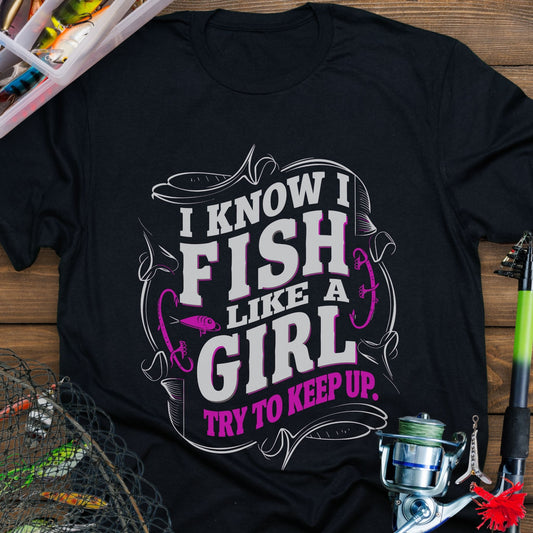 Black Unisex t-shirt with the phrase “Fish Like a Girl Try to Keep Up” featuring a bold script design and graphic fishing elements.