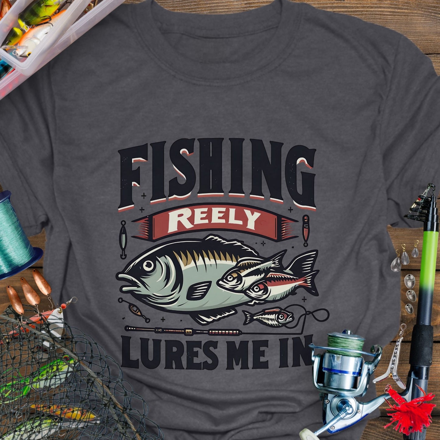 Dark heather Unisex T-shirt featuring the phrase 'Fishing Reely Lures Me In' with a detailed graphic of a fish and fishing lures. Perfect for anglers and fishing enthusiasts, this comfortable tee is great for casual wear, fishing trips, and outdoor adventures.