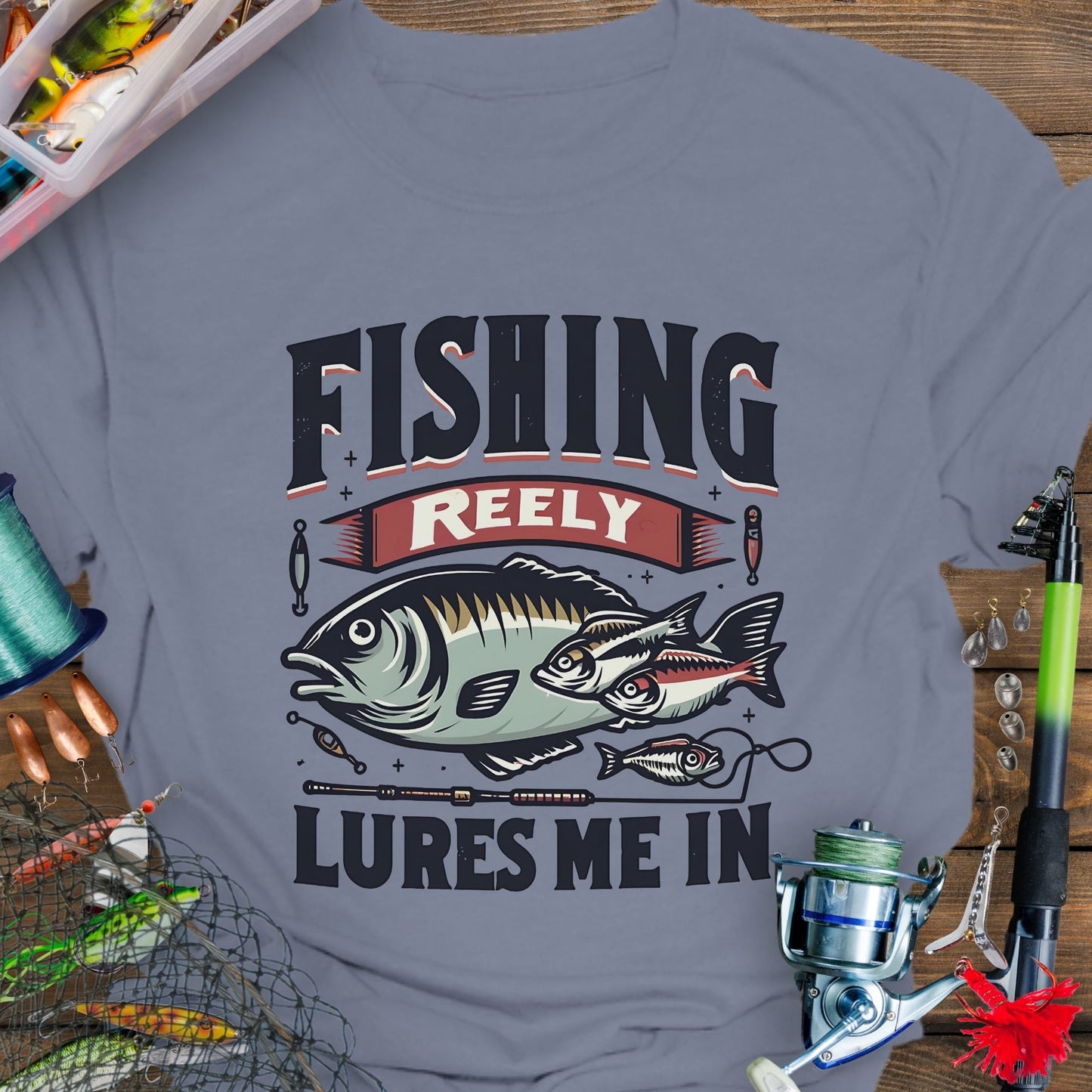 Indigo Bllue Unisex T-shirt featuring the phrase 'Fishing Reely Lures Me In' with a detailed graphic of a fish and fishing lures. Perfect for anglers and fishing enthusiasts, this comfortable tee is great for casual wear, fishing trips, and outdoor adventures.