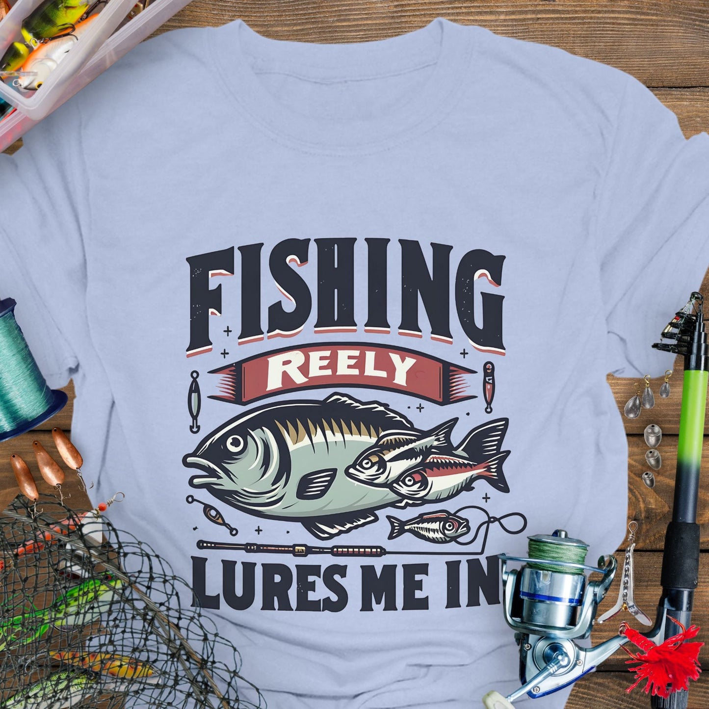 Light blue Unisex T-shirt featuring the phrase 'Fishing Reely Lures Me In' with a detailed graphic of a fish and fishing lures. Perfect for anglers and fishing enthusiasts, this comfortable tee is great for casual wear, fishing trips, and outdoor adventures.