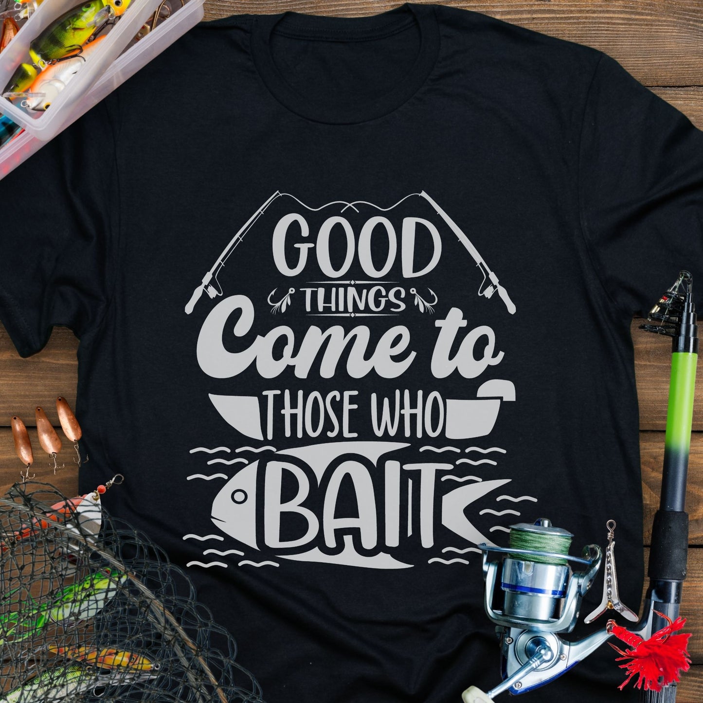 Black t-shirt with Two fishing poles and a fist that says Good Things Come to Those That Wait. Perfect for the angler in your life!