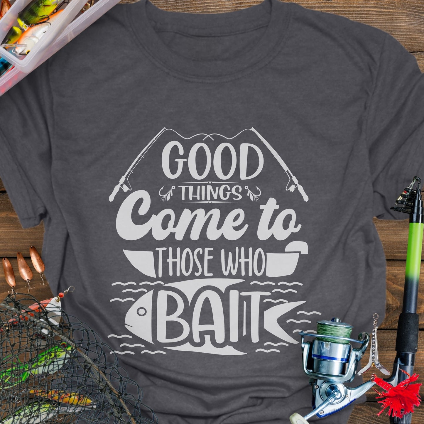 Dark Heather t-shirt with Two fishing poles and a fist that says Good Things Come to Those That Wait. Perfect for the angler in your life!