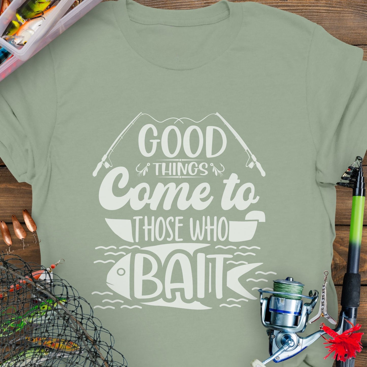 Sage t-shirt with Two fishing poles and a fist that says Good Things Come to Those That Wait. Perfect for the angler in your life!