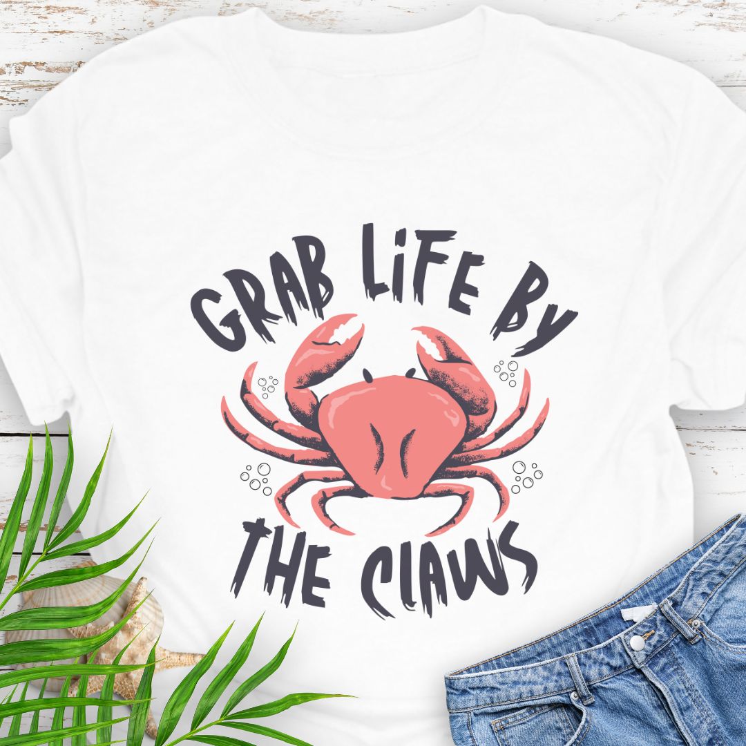 White Unisex t-shirt with 'Grab Life by the Claws' crab graphic on front – coastal-themed summer apparel