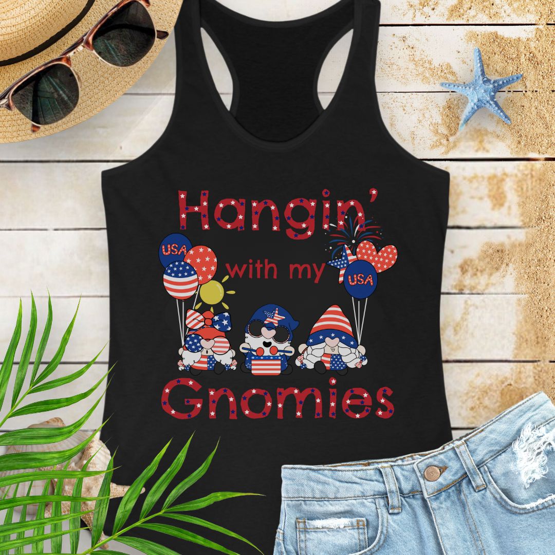 Black women’s racerback tank top with patriotic gnomes holding American flag balloons, with fireworks and sunshine in the background.