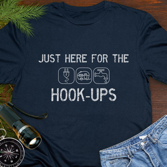 Navy funny camping t-shirt with ‘Here for the Hook-ups’ text and RV utility icons.