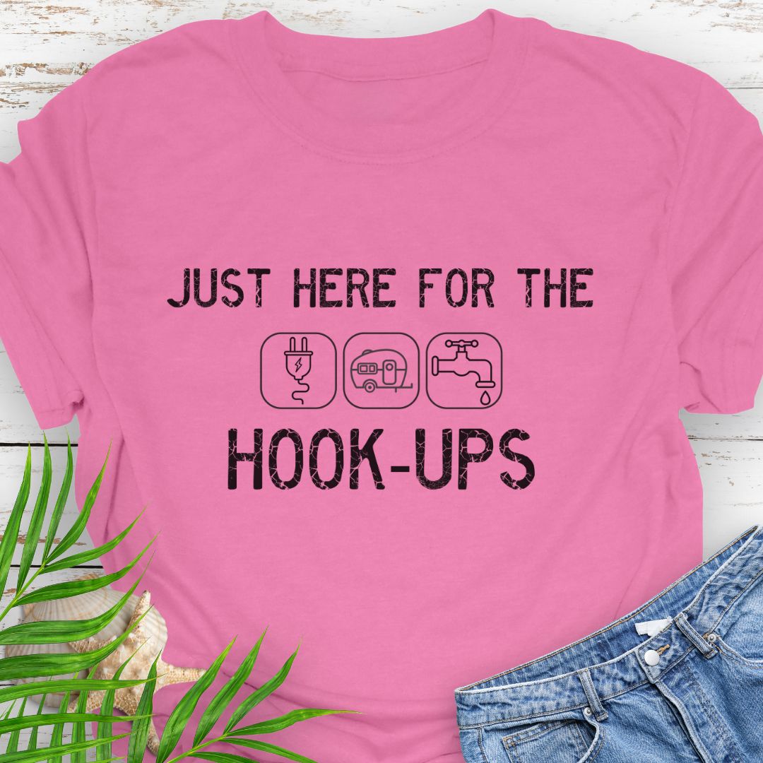 Azalea Pink funny camping t-shirt with ‘Here for the Hook-ups’ text and RV utility icons.