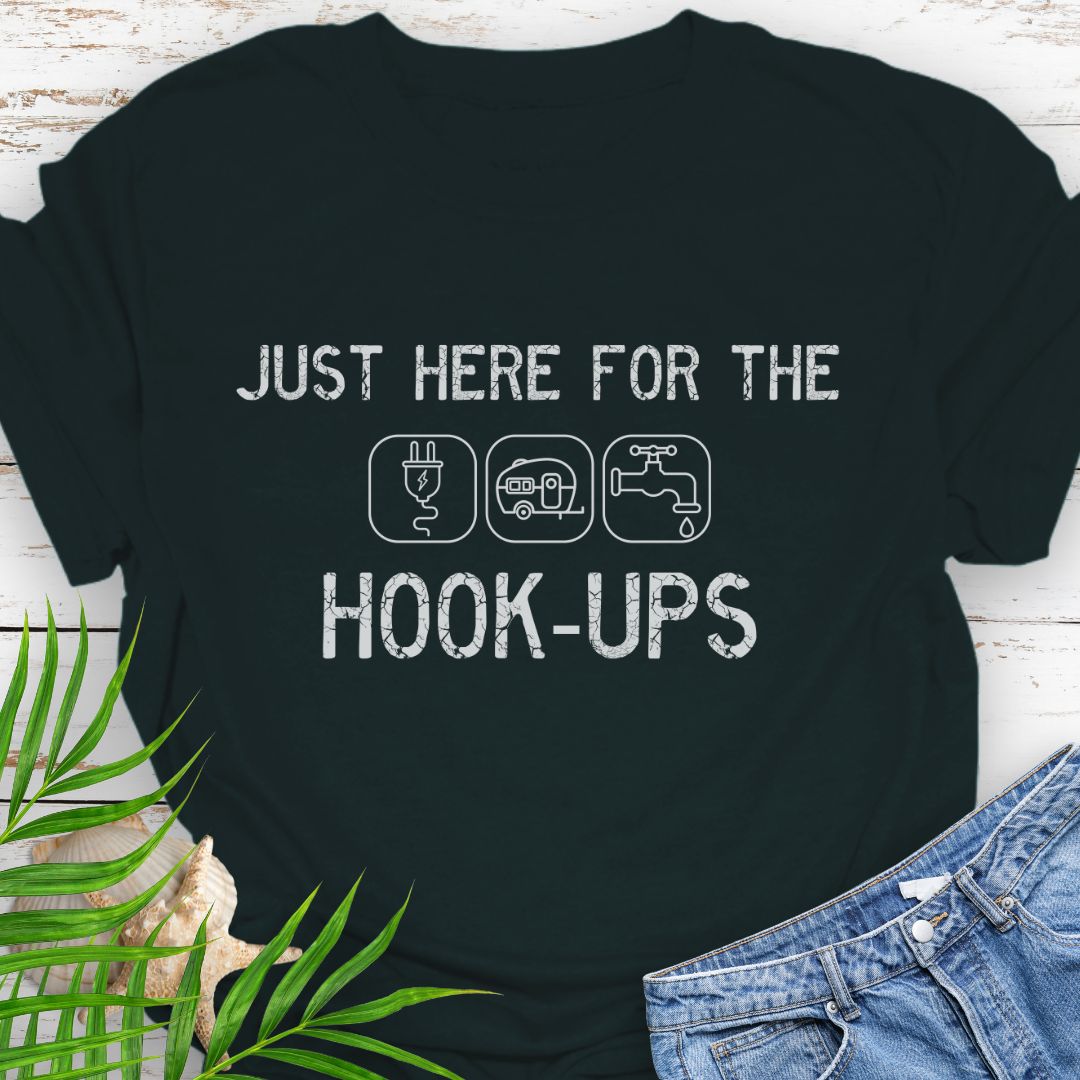 Black funny camping t-shirt with ‘Here for the Hook-ups’ text and RV utility icons.
