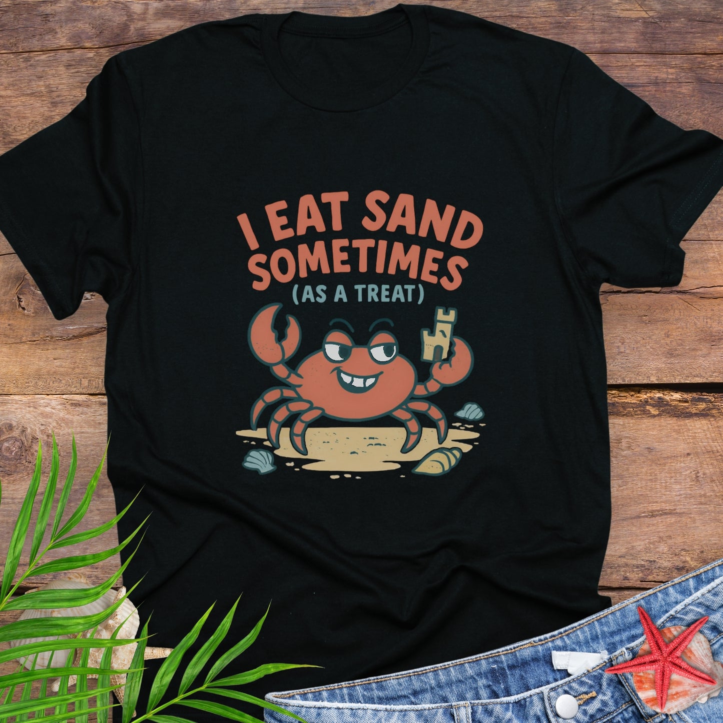 Black I Eat Sand Sometimes as a Treat shirt featuring crab holding sandcastle.