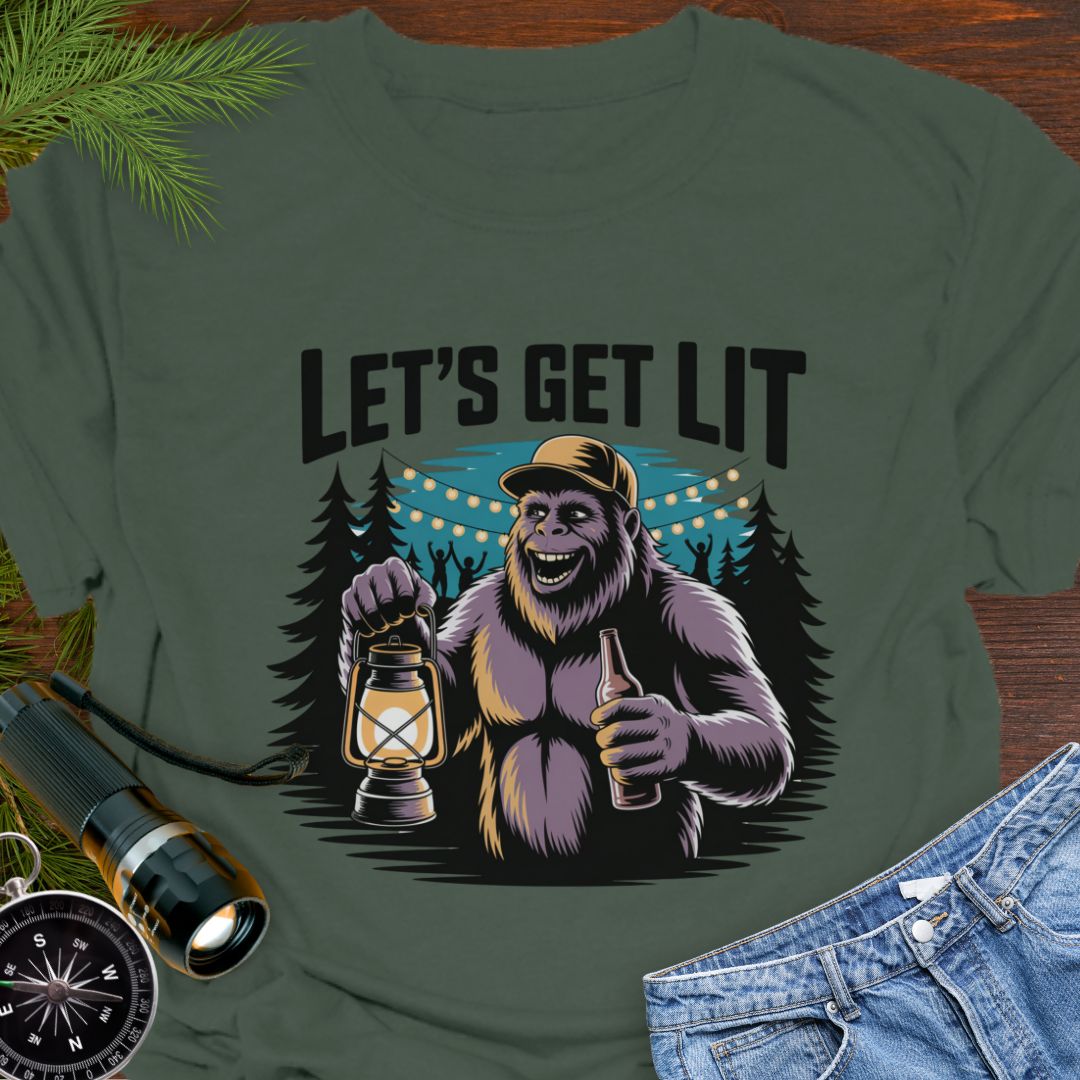 Military Green "Let's Get Lit" Sasquatch T-Shirt featuring a sasquatch wearing a baseball hat holding a camping lantern and a beer in a party scene in the woods.