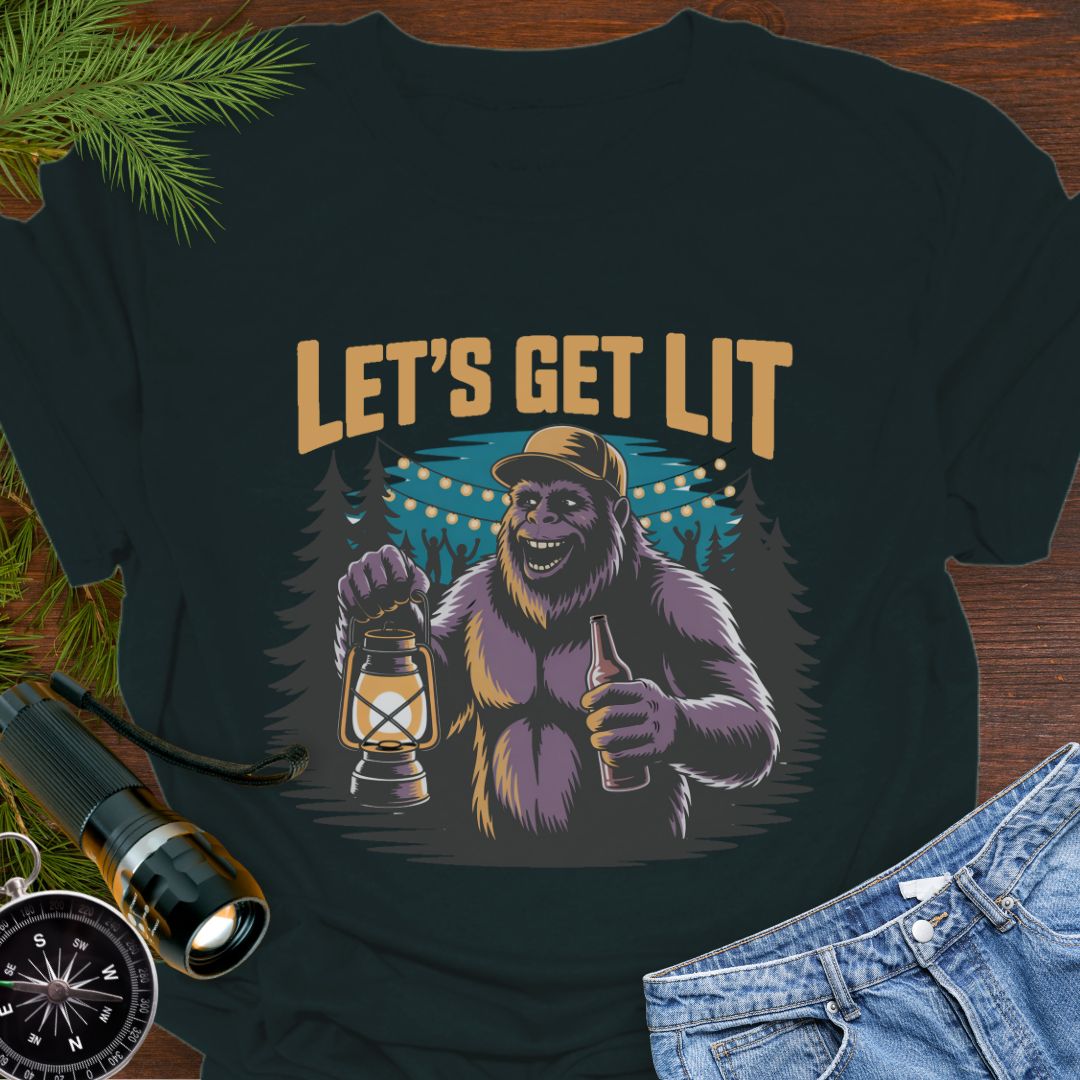 Black "Let's Get Lit" Sasquatch T-Shirt featuring a sasquatch wearing a baseball hat holding a camping lantern and a beer in a party scene in the woods.