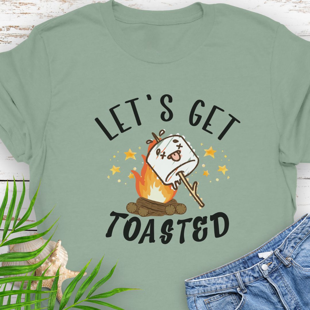 Sage green funny “Let’s Get Toasted” t-shirt with drunk s’more over a campfire for campers who love to party.