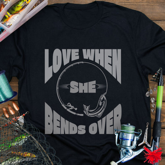 Black T-shirt with a fishing pole bending over and the phrase “Love When She Bends Over” – humorous fishing design for anglers.