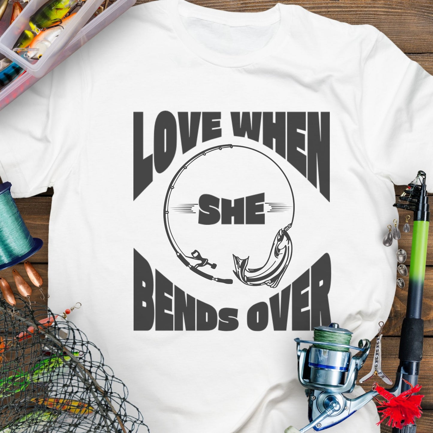 White T-shirt with a fishing pole bending over and the phrase “Love When She Bends Over” – humorous fishing design for anglers.