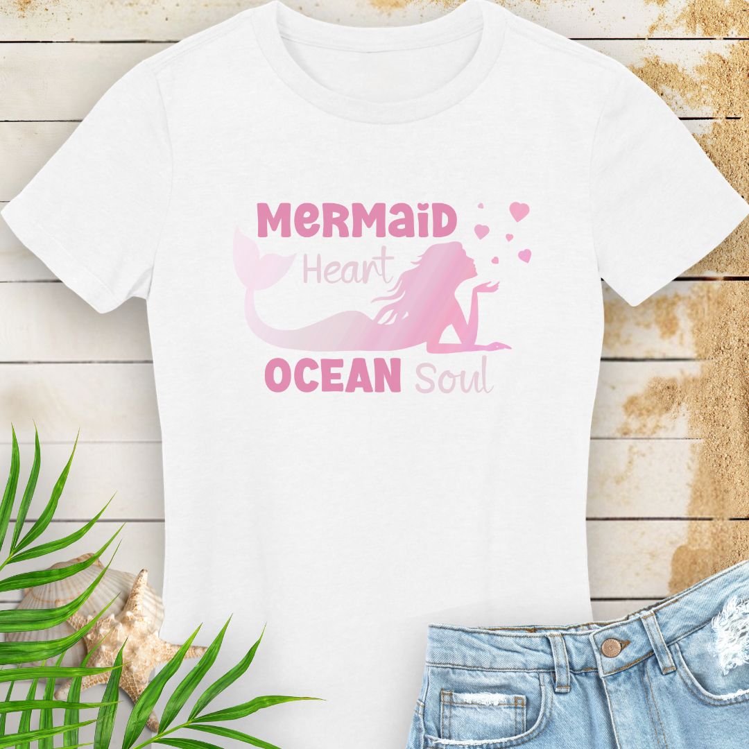 White women's beachy t-shirt with a design of a mermaid blowing heart bubbles in gradient pink with the phrase Mermaid Heart Ocean Soul - for ocean lovers, perfect for summer vacations and dreamy coastal vibes.