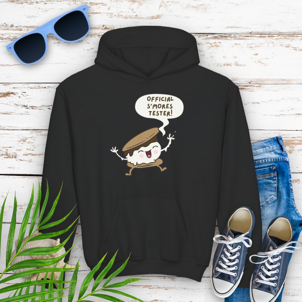 Black Youth hoodie with "Official S’mores Tester" text in a speech bubble with cartoon s'more – fun camping-themed sweatshirt for kid.