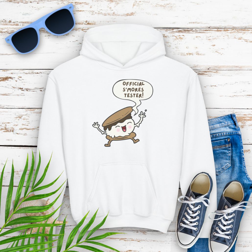 White Youth hoodie with "Official S’mores Tester" text in a speech bubble with cartoon s'more – fun camping-themed sweatshirt for kid.