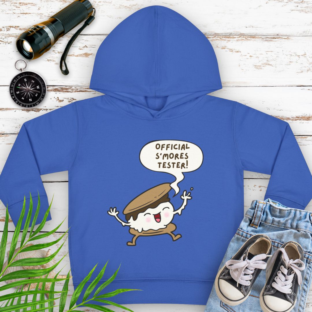 Vintage Royal cozy toddler hoodie with “Official S’mores Tester” speech bubble and a cartoon s'more – cute outdoor-themed sweatshirt for little campers.