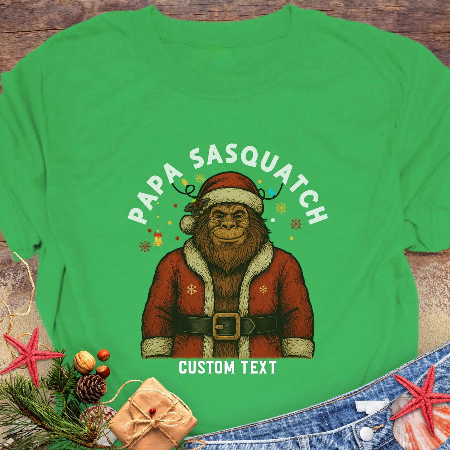 Green t-shirt with a Sasquatch wearing a Santa outfit and 'Papa Sasquatch' text with custom text.