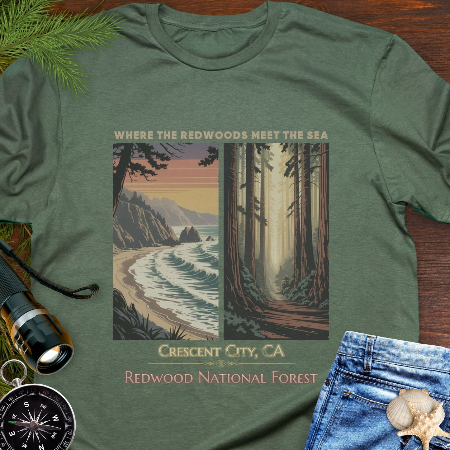 Green t-shirt with nature-themed design featuring Redwood National Forest, displayed on a wooden surface with accessories.