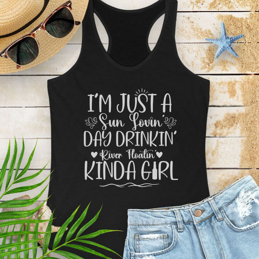 Black women’s racerback tank top with the phrase "Sun-loving, Day-drinking, River-floating Kind of Girl" printed on the front in a relaxed, summer-ready fit.