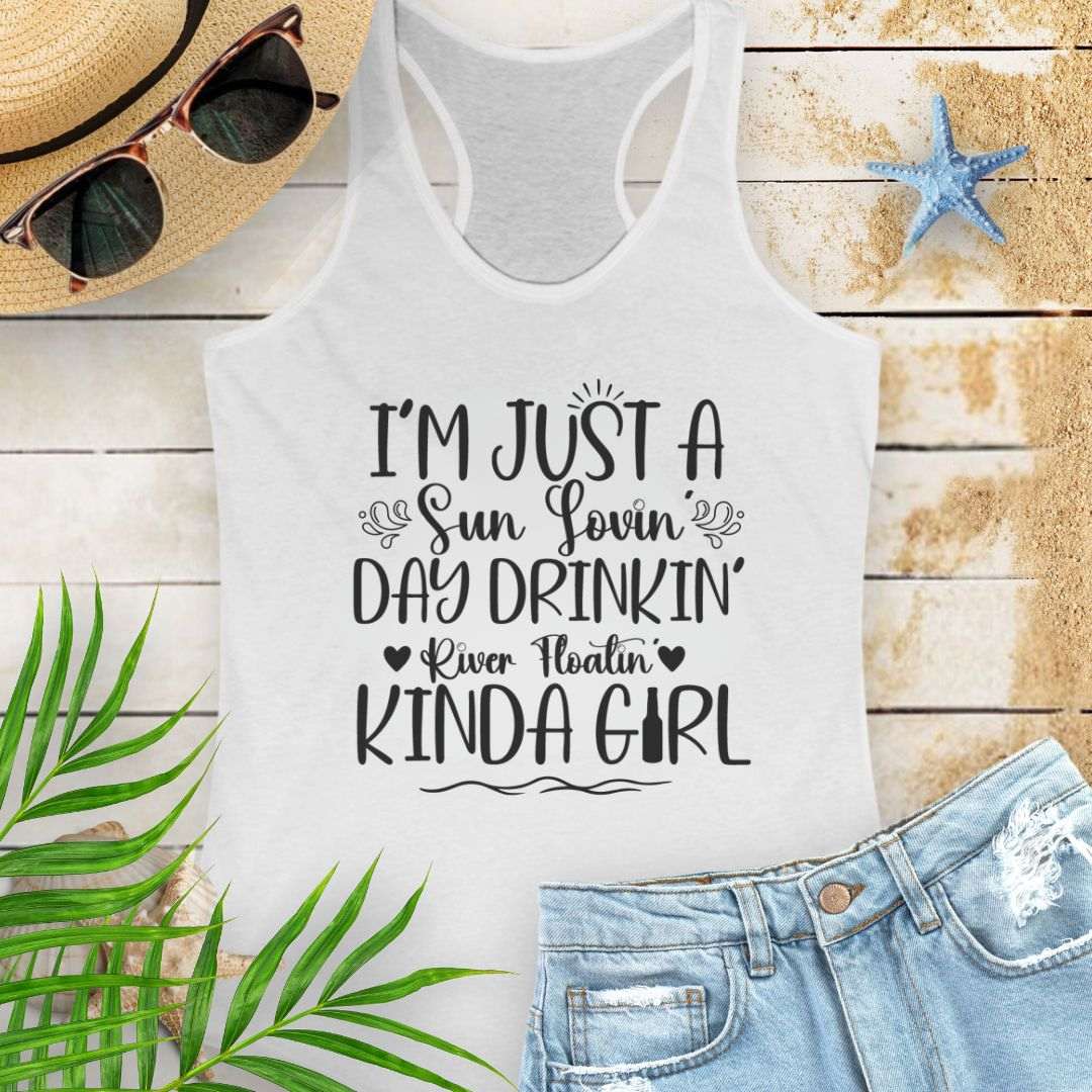 White women’s racerback tank top with the phrase "Sun-loving, Day-drinking, River-floating Kind of Girl" printed on the front in a relaxed, summer-ready fit.