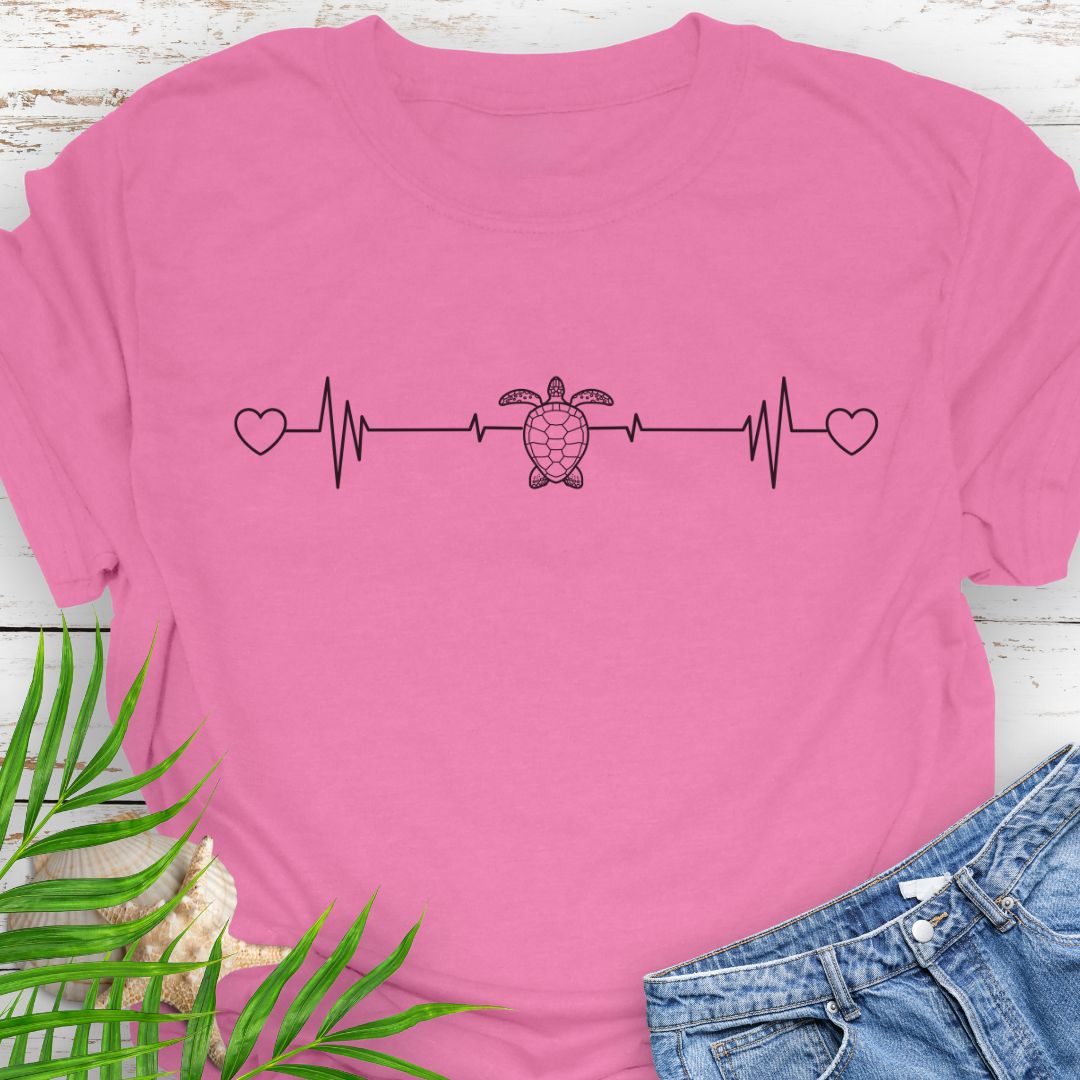Azalea T-shirt with ocean heartbeat design with sea turtle in center symbolizing love for sea turtles.