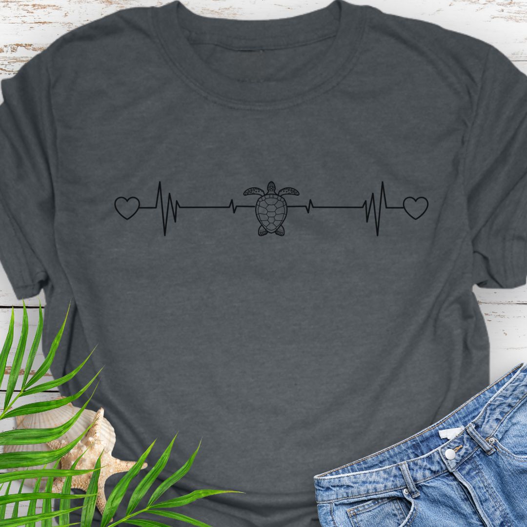 Dark Heather T-shirt with ocean heartbeat design with sea turtle in center symbolizing love for sea turtles.