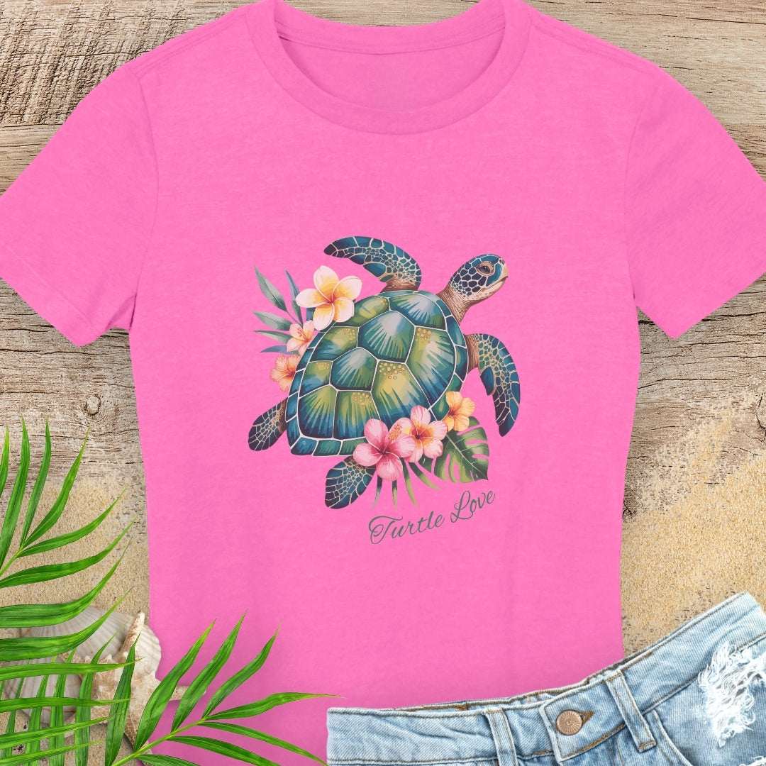 Pink woman's t-shirt with a sea turtle and hibiscus flower design.